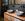 Zwarte badkamer in Andel met houtlook meubel en terrazzo waskommen