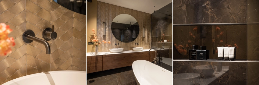 Impressie van een luxe badkamer met marmer, goud en een royaal houten badkamermeubel